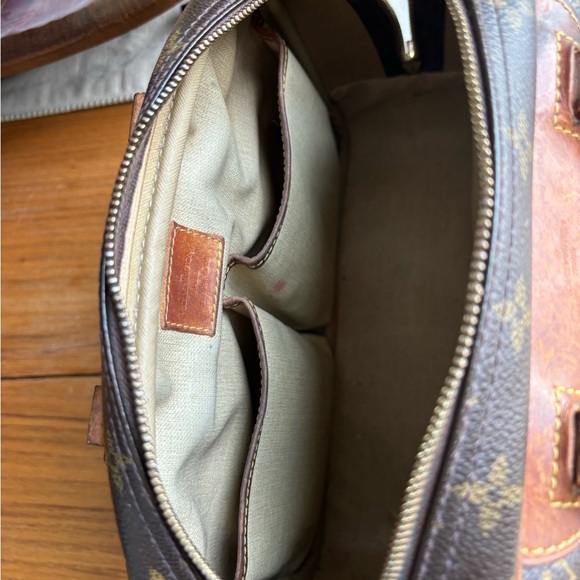 Well loved pre-owned authentic Louis Vuitton Trouville handbag. - Picture 4 of 14